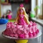 Barbie Cake : 15 Secrets to Stunning Creations 4 A Barbie doll cake decorated with pink frosting roses and a shimmering pink bodice.