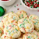 Christmas gooey butter cookies arranged in a festive gift tin