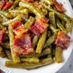 Crack Green Beans baked in a sweet and savory glaze served in a casserole dish