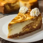 Slice of Thanksgiving pumpkin cheesecake with whipped cream and caramel drizzle