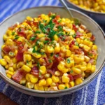 Fresh Corn & Turkey Bacon Side Dish 4 Fresh Corn & Turkey Bacon Side Dish served in a bowl with chopped herbs on top.