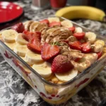 Strawberry Banana Pudding Dream in trifle dish layers of pudding, bananas, strawberries, wafers
