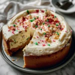 Decadent Sugar Cookie Cheesecake – Easy & Trendy Dessert Idea 3 Sugar Cookie Cheesecake whole cake on a festive plate