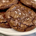 Freshly baked Baileys Chocolate Cookies with gooey chocolate chips and a glass of Baileys Irish Cream