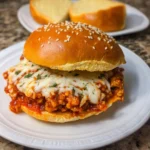 Chicken Parmesan Sloppy Joes with melted cheese and tomato sauce