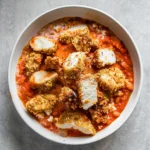 Cottage Cheese Chicken Parm Bowl with chicken breast, creamy cottage cheese, and fresh basil.