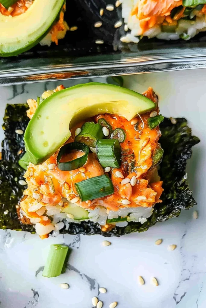 Spicy Salmon Sushi Bake – Easy and Flavorful Dinner Recipe 5 Mini spicy salmon sushi bake cups with avocado and sesame seeds